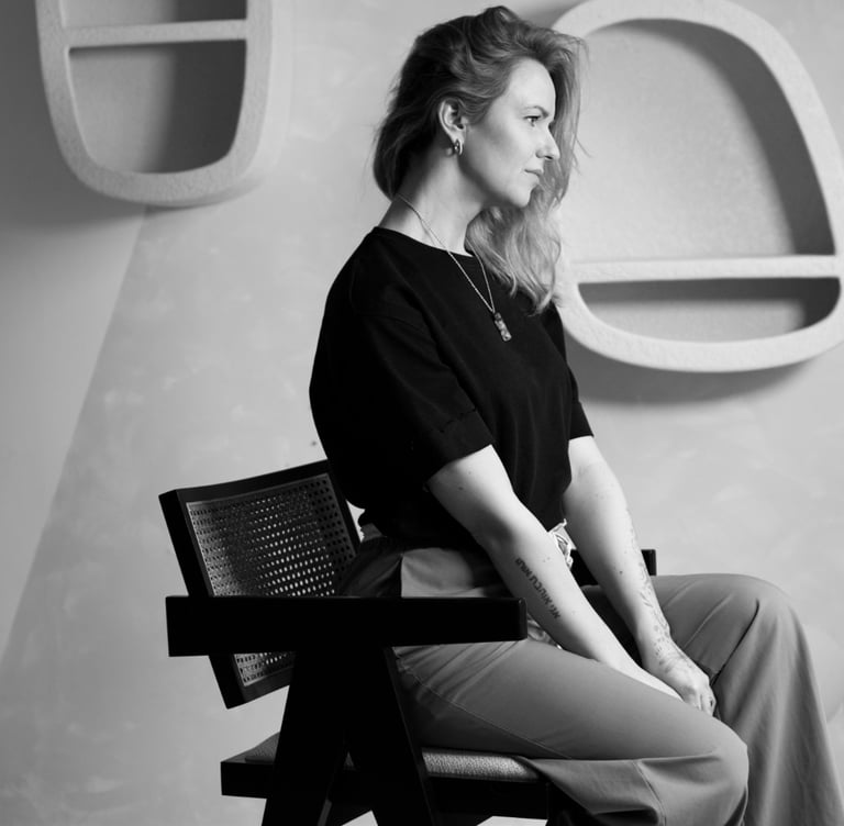 a woman sitting on a chair in a chair