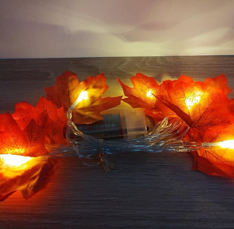 Battery-operated maple leaf string lights with 20 warm orange LEDs on a 9.8ft copper wire,