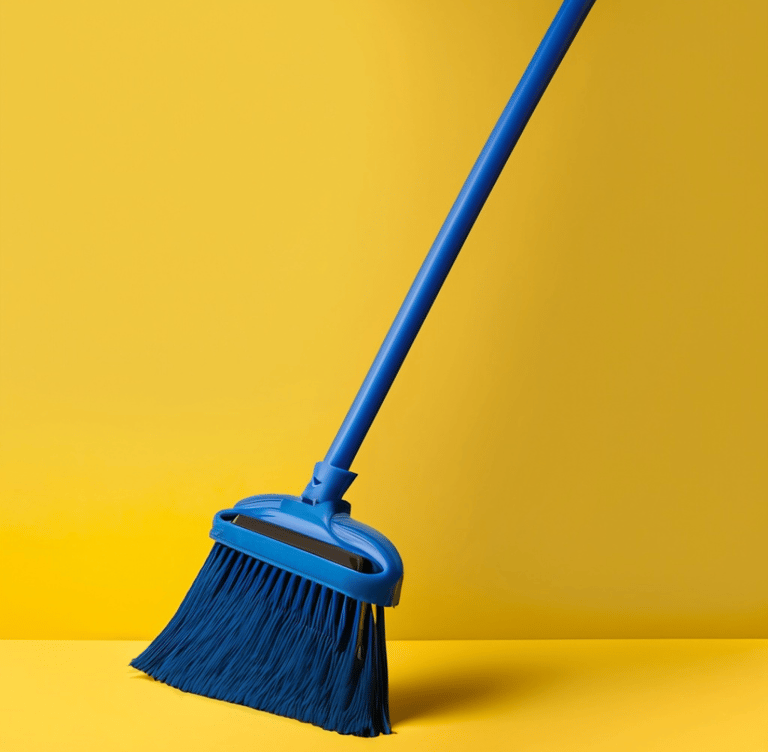 a broom with a yellow background