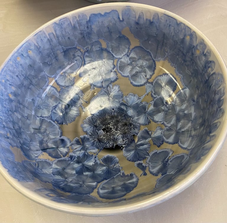 A crystalline glazed ceramic bowl.
