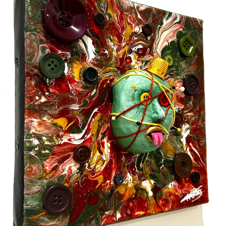 a painting of a face with buttons