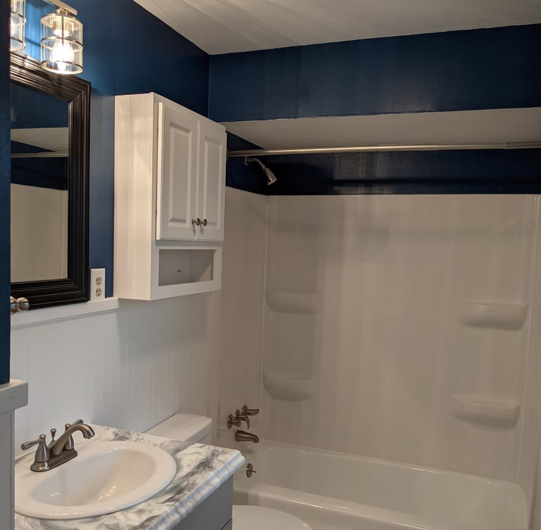 bathroom remodel using carpentry, epoxy, re-glazing and new product installation