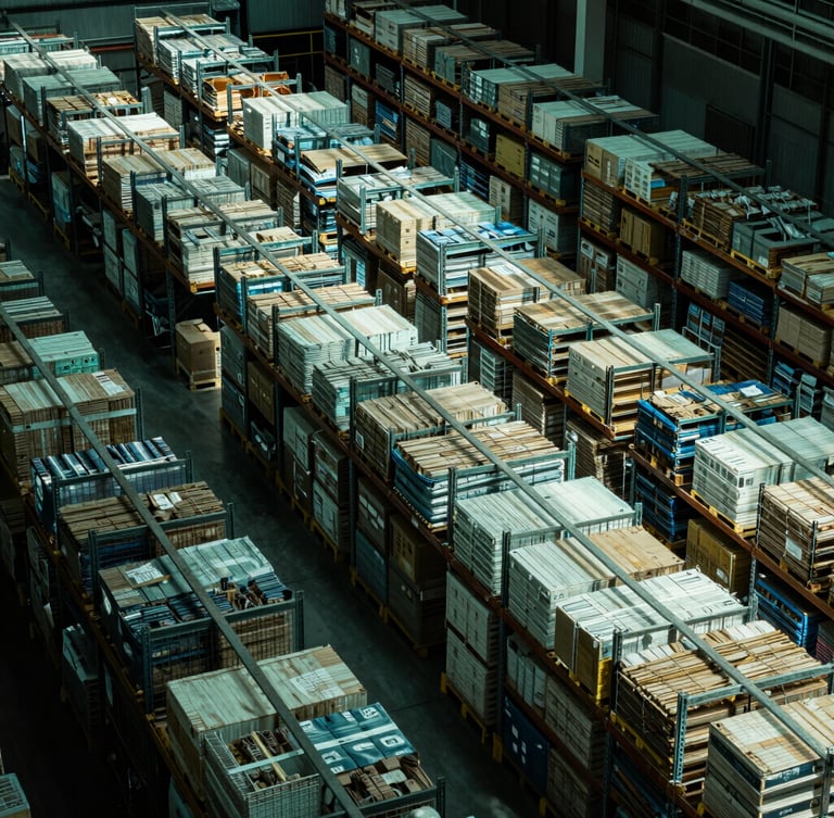 High-contrast overhead view of structured warehouse logistics, sharp geometric lines, cool crisp green-tinted lighting, deep shadows.