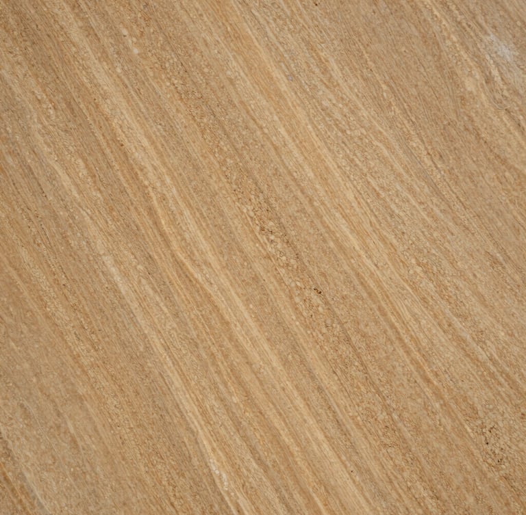 Macro close-up of a premium polished travertine slab, rich warm sand tones, intricate natural cavities and parallel vein patterns catching sharp side-lighting, architectural texture.