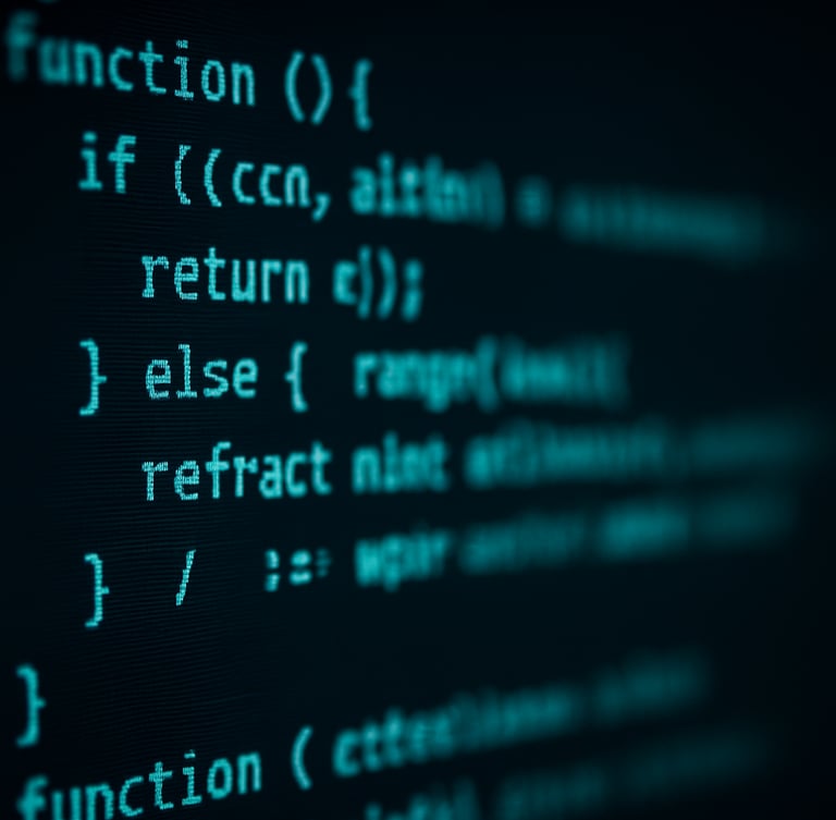 Macro close-up of clean code on a high-resolution screen in a dark room, cool cyan terminal glow, sharp focus