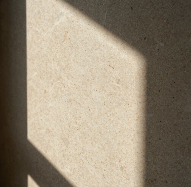 Extreme close-up of un-honed travertine texture, warm afternoon window light, deep shadows, cream and travertine tones, medium format film