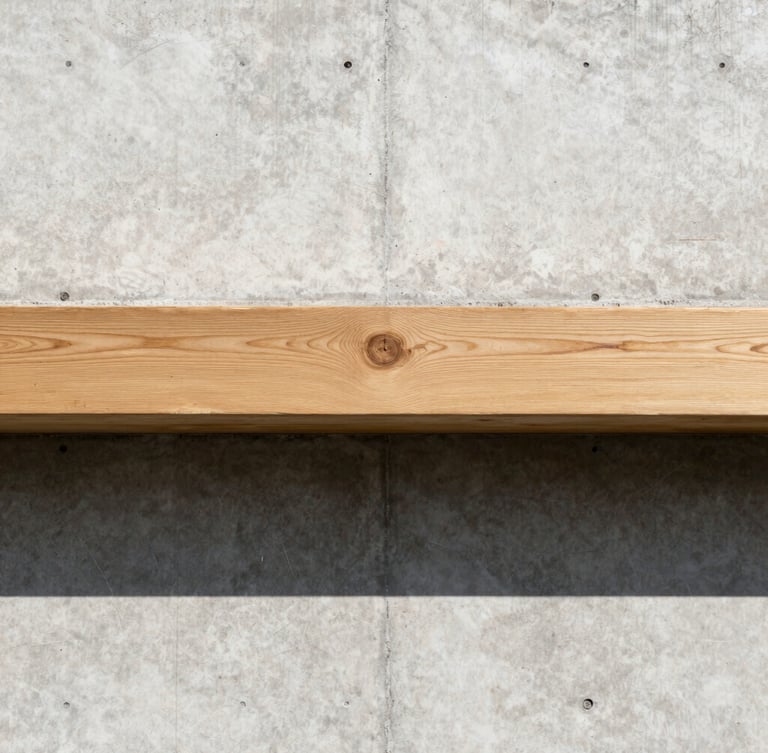 Straight-on architectural elevation of a concrete wall meeting a perfectly aligned raw oak timber beam, sharp daylight casting graphic shadows, technical precision layout.