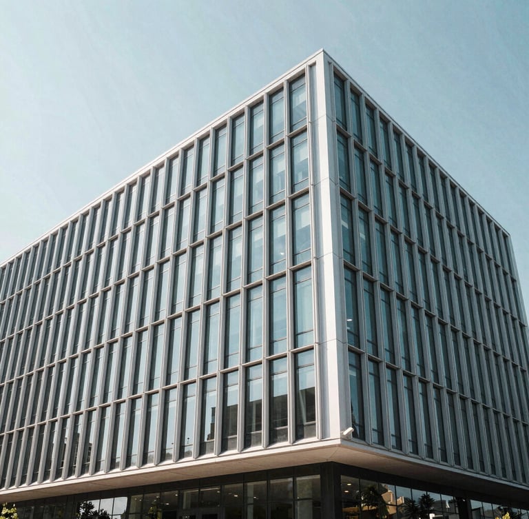 Wide architectural angle of a modern minimalist corporate building facade in Wilmington, clean steel and glass lines, bright cool daylight, high clarity.