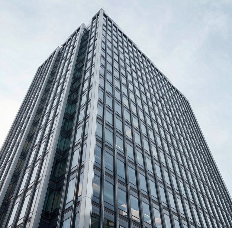 Wide architectural angle of a modern minimalist corporate skyscraper facade in Wilmington, clean steel and glass lines against a bright neutral daylight sky, cool tones, high clarity.