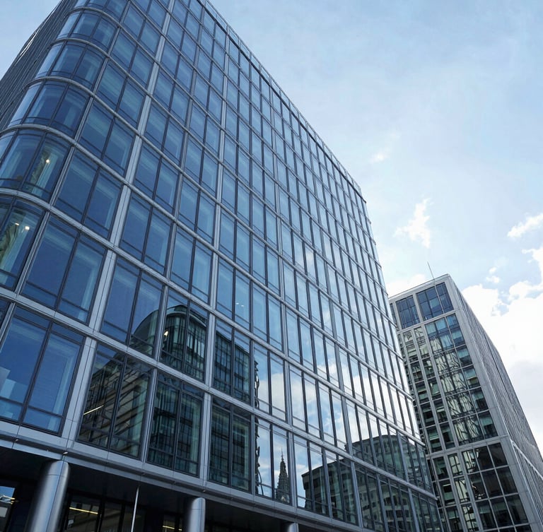 Wide-angle architectural photograph of a modern glass corporate headquarters in London, cool crisp daylight, deep blue reflections, high-end institutional aesthetic