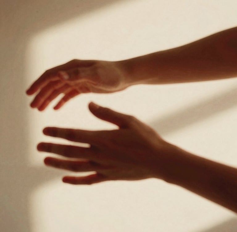 Close-up of hands and arms in motion with intentional motion blur, warm studio lighting, soft shadows, 35mm film grain, cream and cherry red tones