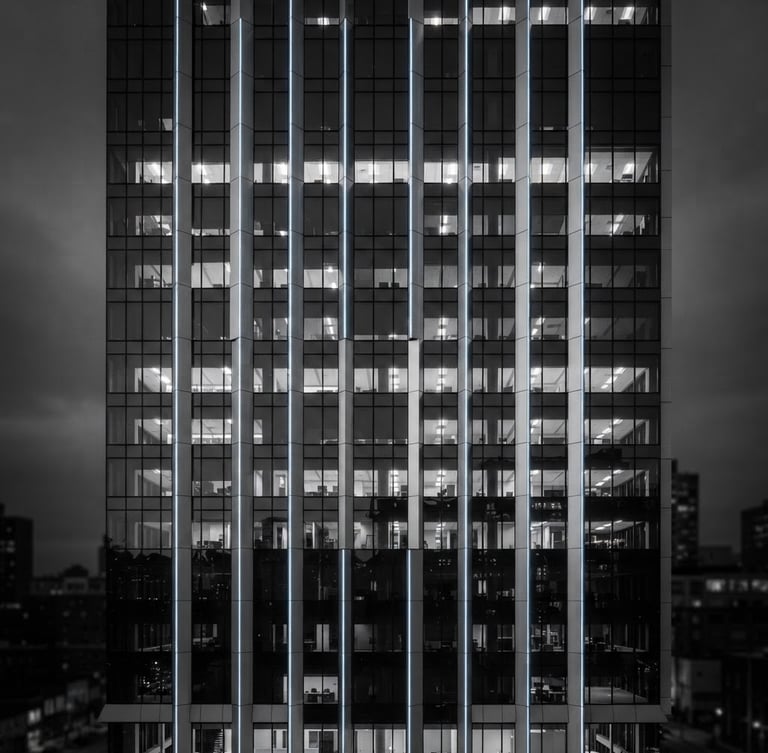 Sleek architectural photography of commercial building facade with integrated smart LED lighting, cool high-key studio lighting, monochrome with subtle blue LED accents, sharp focus, 35mm