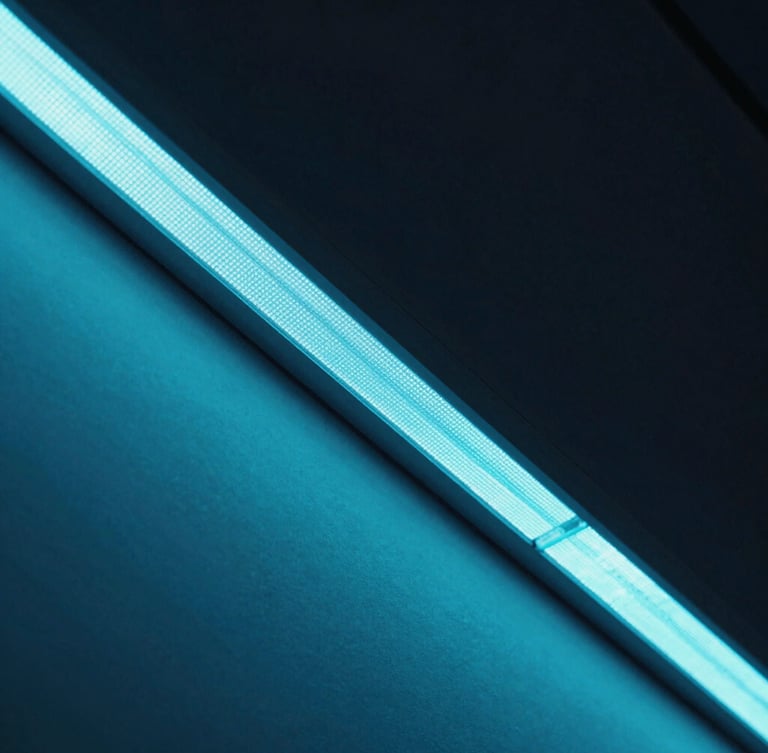 Sleek close-up of a commercial LED display bezel, showing sharp pixel density and cool cyan glow, high-contrast architectural framing