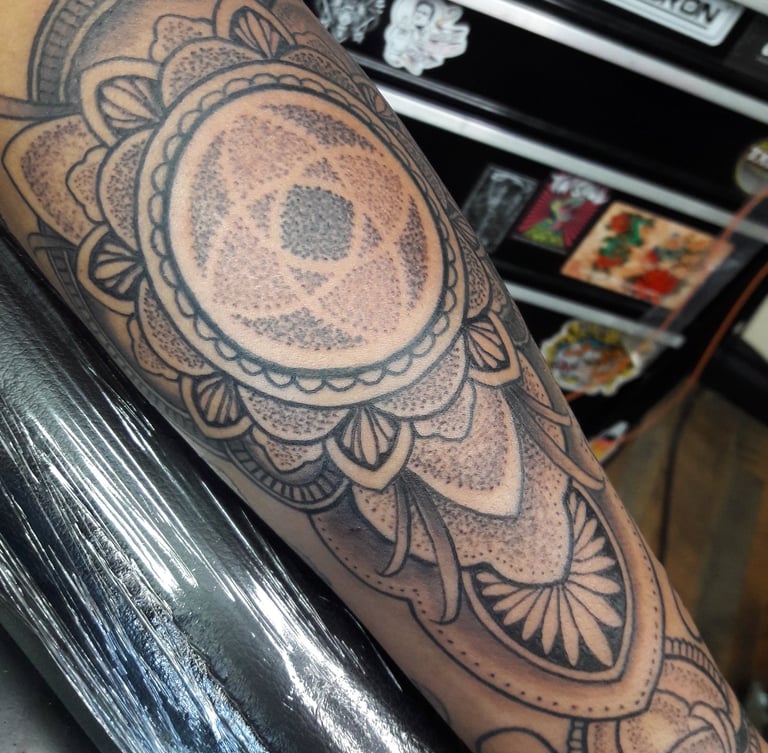 Dotwork mandala with ornamental elements