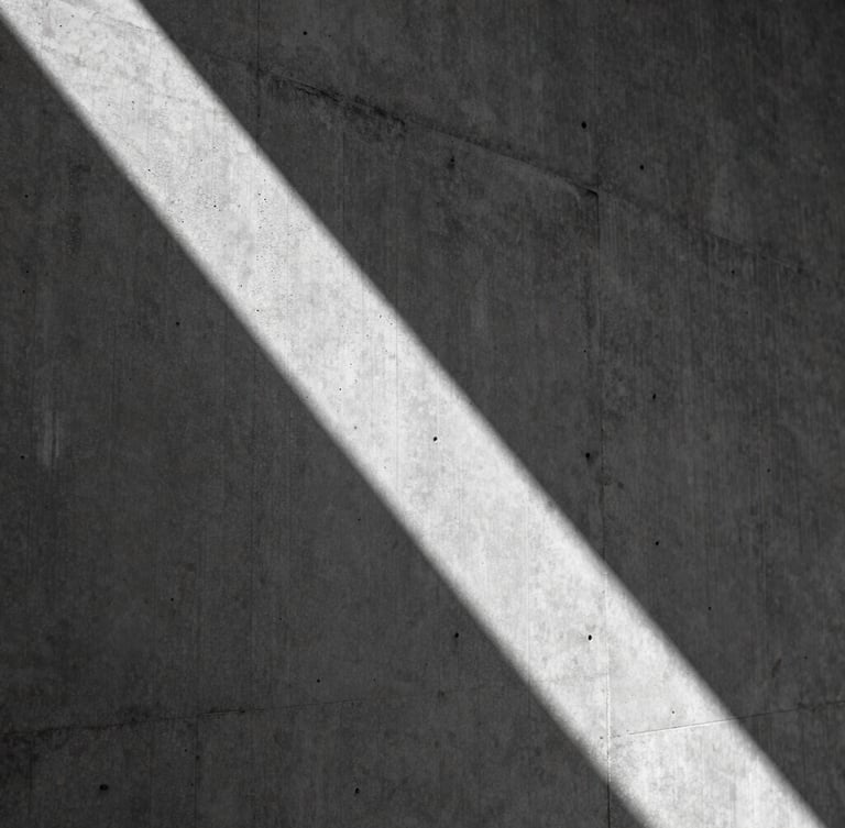Abstract architectural macro detail of raw board-formed concrete texture, sharp diagonal geometric shadow, high-contrast black and white, cold clinical silence.