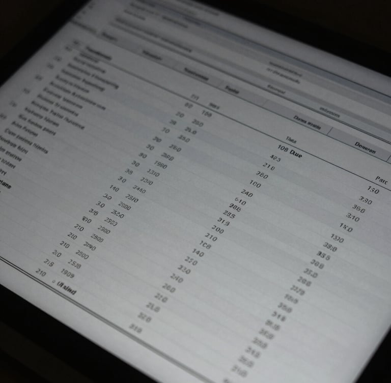 Close-up of structured data on a dark screen in a low-key corporate environment, cool desaturated tones, sharp focus, 35mm