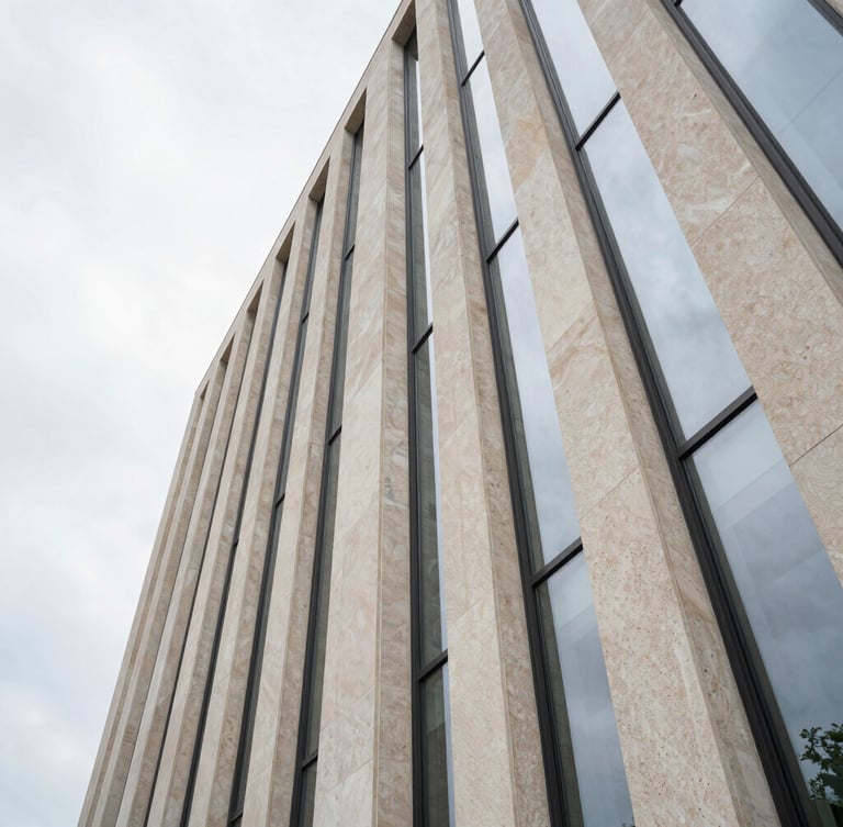 Extreme wide-angle architectural composition of a limestone facade under diffused overcast daylight, clean glass lines, minimalist luxury, negative space on the left