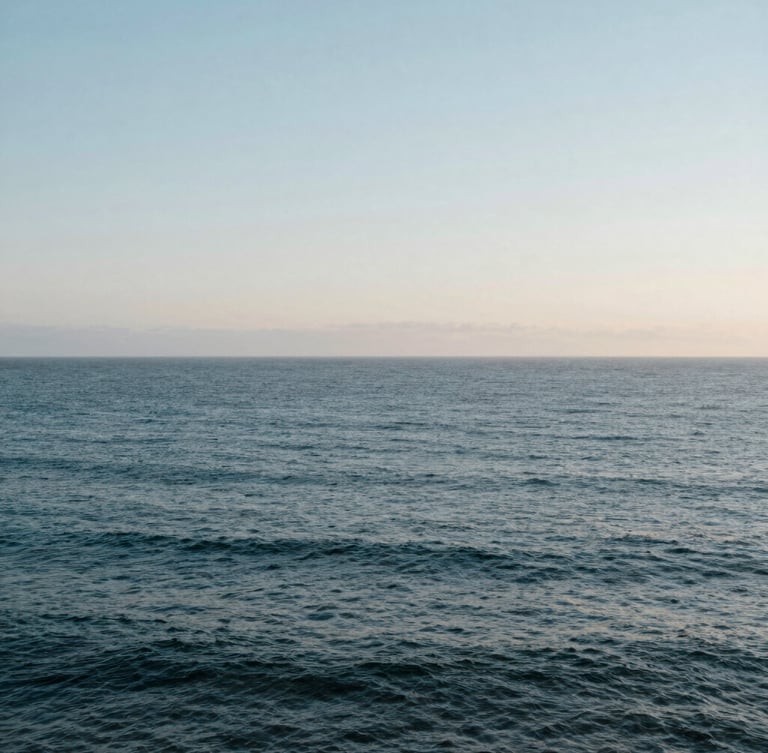 Expansive ocean horizon in Manhattan Beach under soft, diffused morning light, high negative space, calm coastal atmosphere.