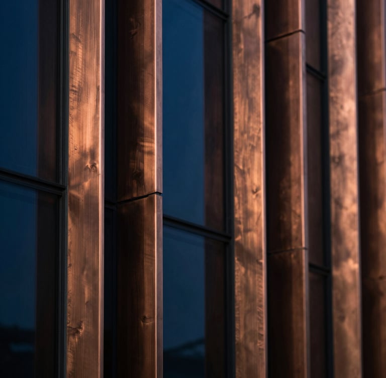Extreme macro detail of brushed copper and dark glass architectural panels, dramatic low-key lighting with deep sapphire shadows, sharp focus, 35mm