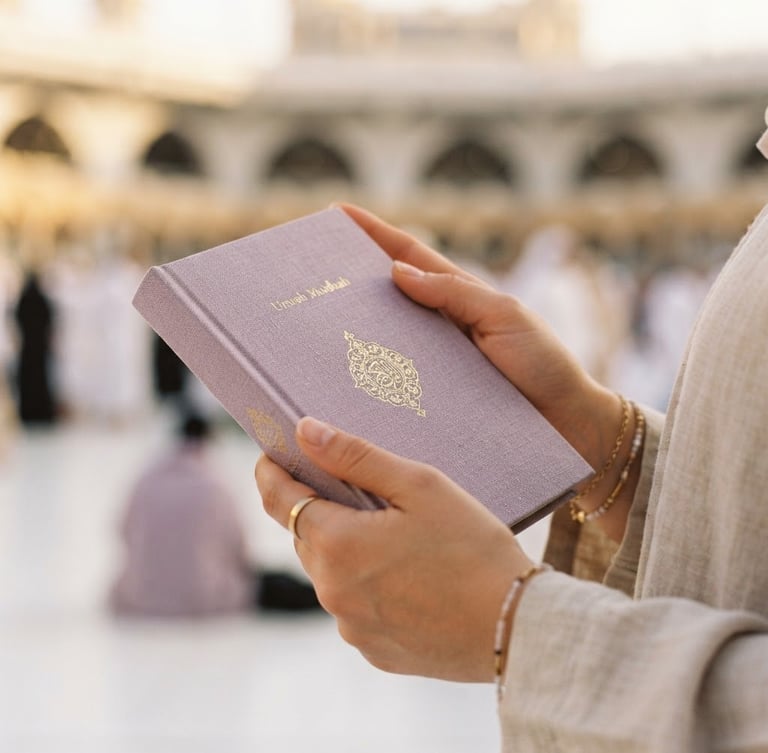 Close-up of hands holding a linen-bound Umrah guidebook in soft morning light, shallow depth of field, 35mm