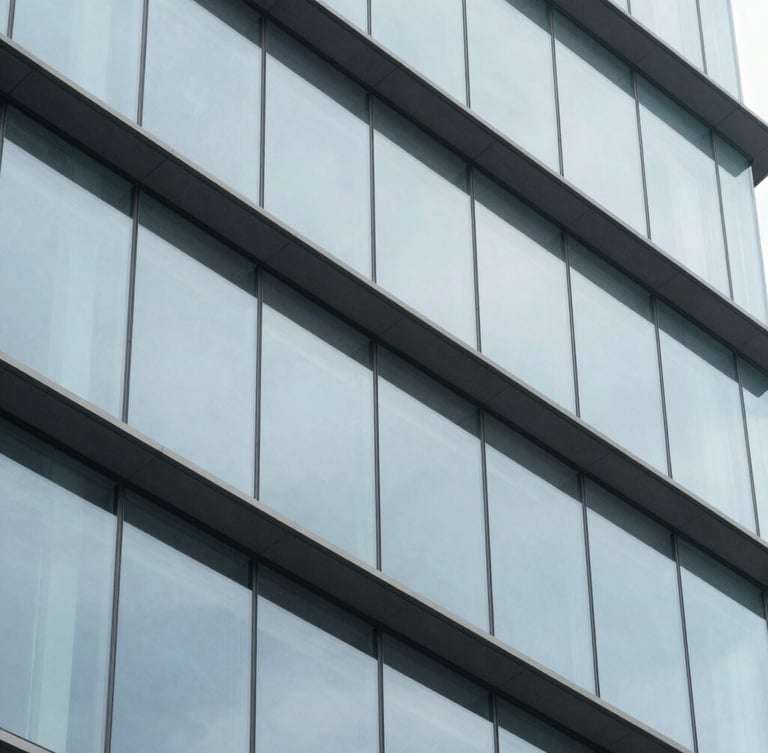 Abstract macro shot of structured modern architectural elements, steel and glass facade, clean grid lines, cool daylight, 35mm.
