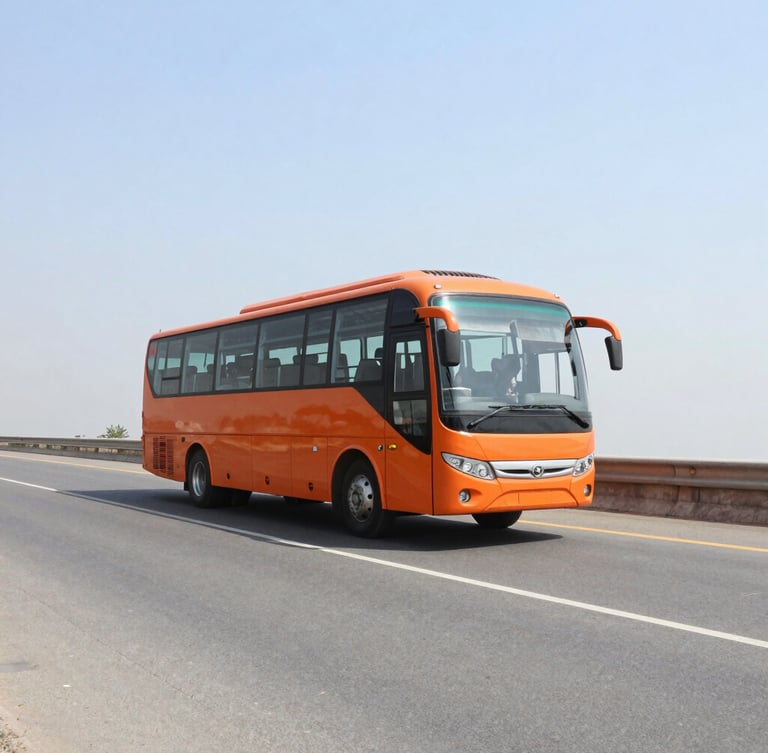 Wide-angle crisp 35mm photo of a modern orange intercity sleeper bus driving on a clean Indian highway under bright daylight, negative space on the left