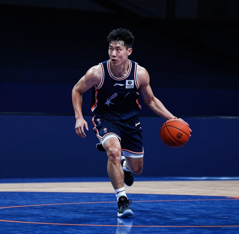 Dynamic low-angle shot of a basketball player mid-dribble on an indoor court, dramatic side-lit sweat, high-contrast stadium lighting, deep blue atmosphere with sharp orange court lines