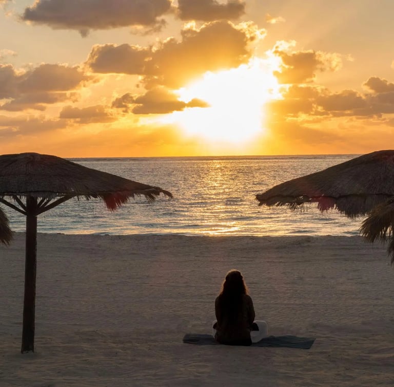 grieving woman on beach in Mexico at retreat