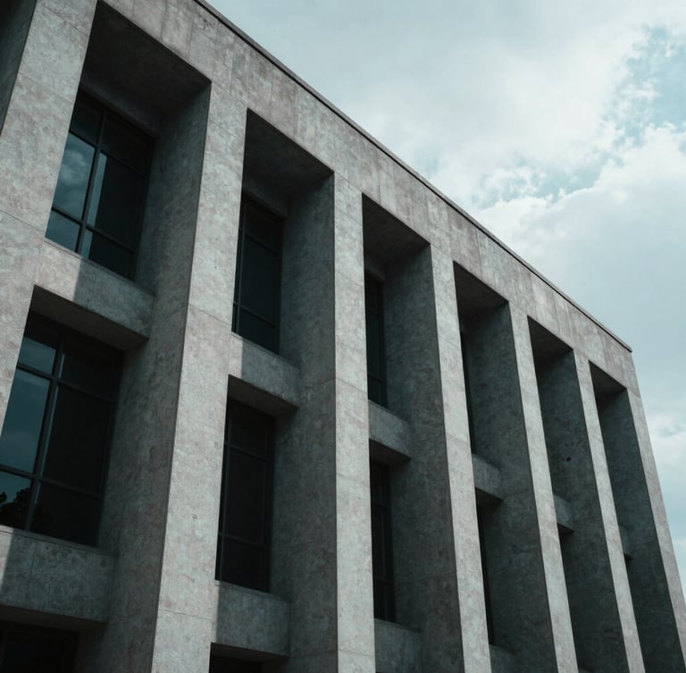 Low-angle architectural photography of a modern courthouse facade with sharp geometric concrete lines, dramatic high-contrast shadows, cool overcast daylight, projecting absolute legal authority, 35mm