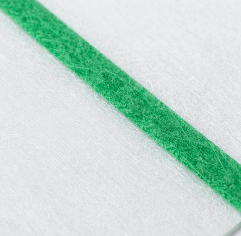 Macro shot of raw spunlace nonwoven fabric texture, bright sterile white laboratory light, clean green details, sharp focus