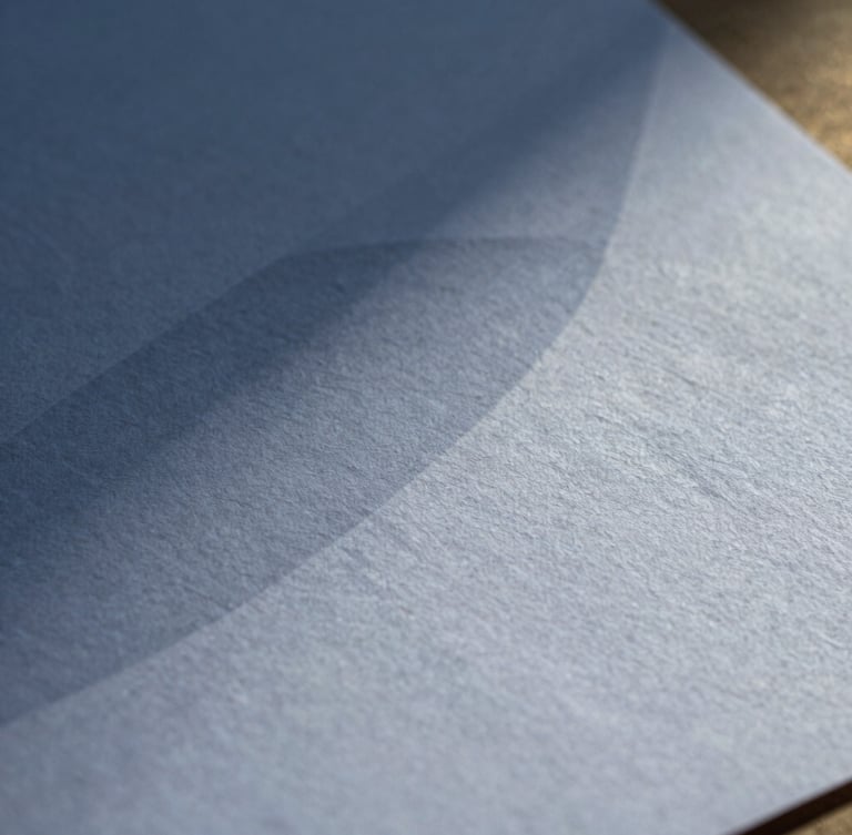Macro close-up of textured high-quality heavy cotton paper with abstract geometric shadows cast across the surface, crisp natural light, elegant editorial feel