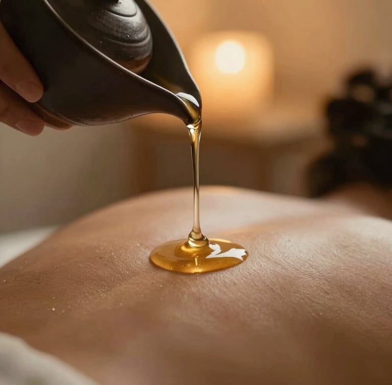 Macro portrait of warm massage oil dripping slowly from a dark ceramic vessel onto smooth, warm skin, dramatic low-key lighting, soft golden amber backlighting, shallow depth of field.