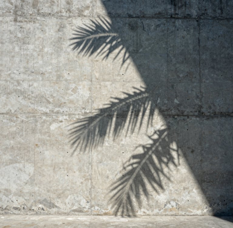Strict one-point perspective of a monolithic concrete facade, sharp tropical shadows cutting across raw stone textures, bright daylight, negative space on the left.