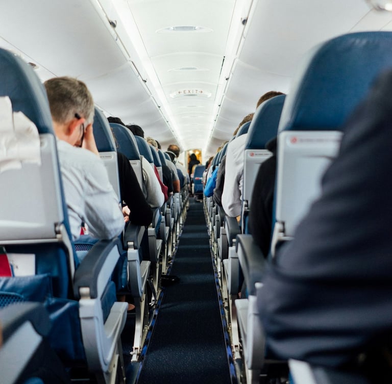 Interior of airplane with sitting people