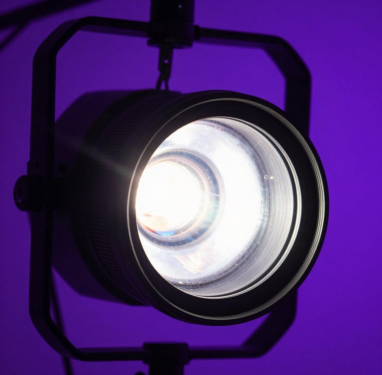 Extreme close-up macro shot of professional concert lighting rigs, lens flare, neon purple backlighting, deep shadows