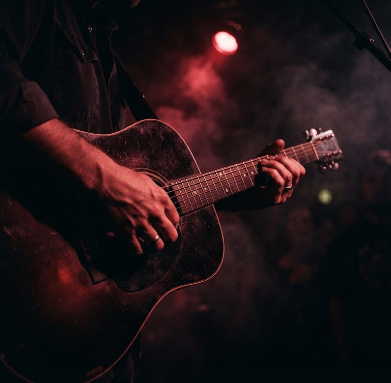 Close-up of hands playing a dark acoustic guitar in a smoke-filled room, low-key chiaroscuro lighting, single red light source casting dramatic shadows, cinematic 35mm film.