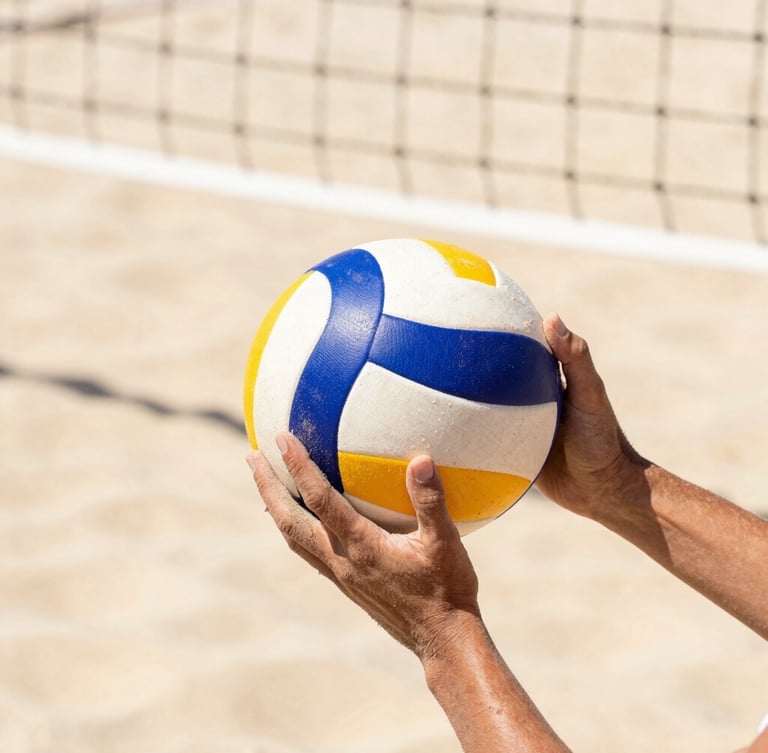 Close-up of sand-covered hands holding a professional volleyball, crisp net lines in the background, bright high-contrast sunlight, shallow depth of field, 35mm