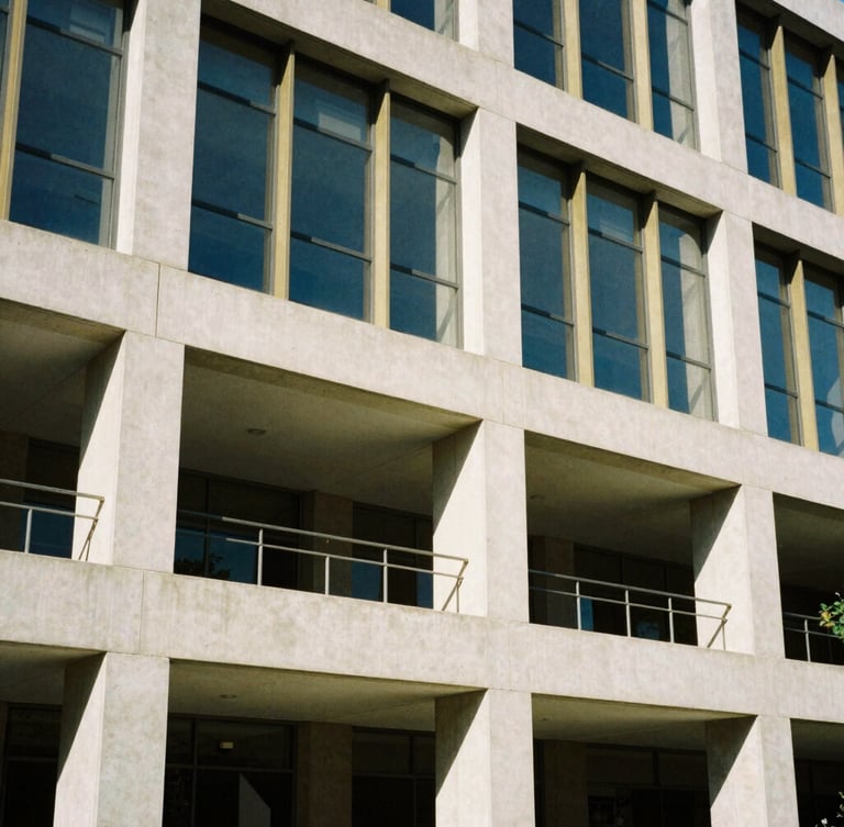 Striking architectural crop of modern concrete and glass campus building facade, bright natural daylight, geometric shadows, 35mm editorial photography.
