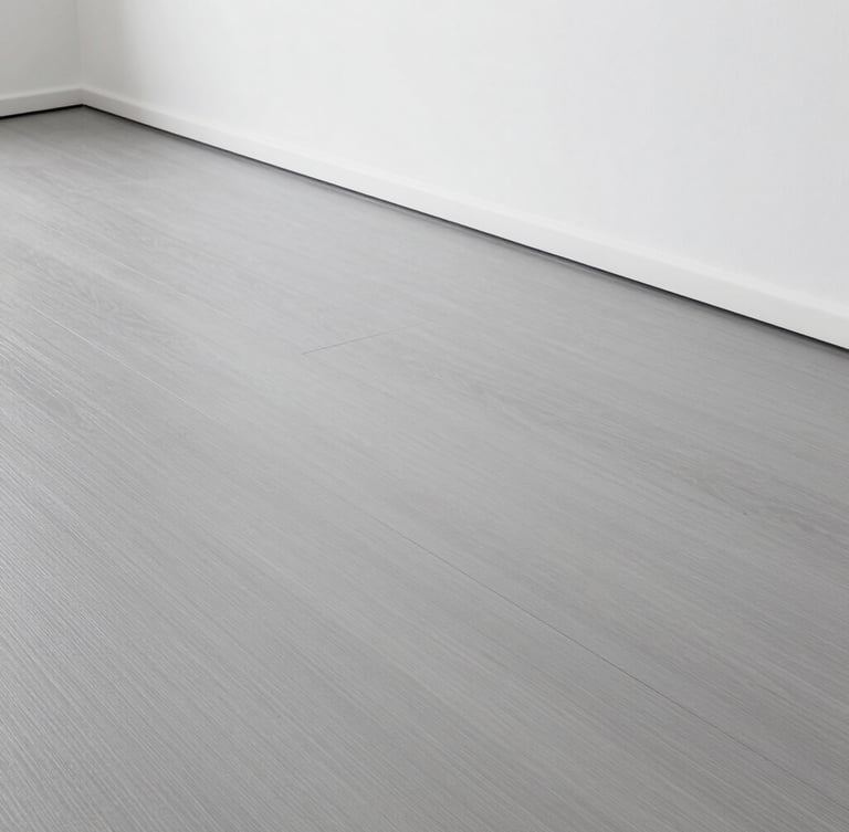 Straight-on architectural shot of a perfectly laid modern grey vinyl floor, clean sharp edges along a minimalist white wall, bright clinical daylight, dust-free surface.
