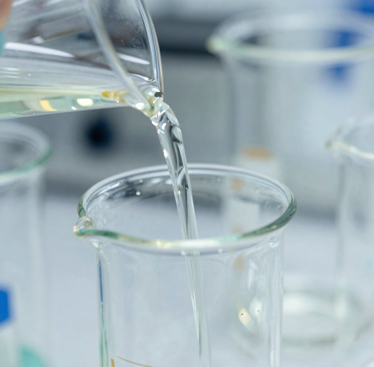 Macro close-up of high-end borosilicate glassware reflecting light, precise pouring of chemical compounds, bright cleanroom lighting, sharp focus, 35mm