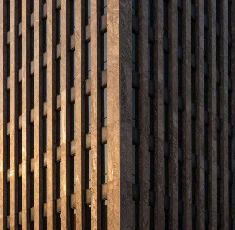 Prestigious architectural photography of a modern Saudi corporate building facade, strong geometric shadows, warm golden-hour window light, minimalist composition