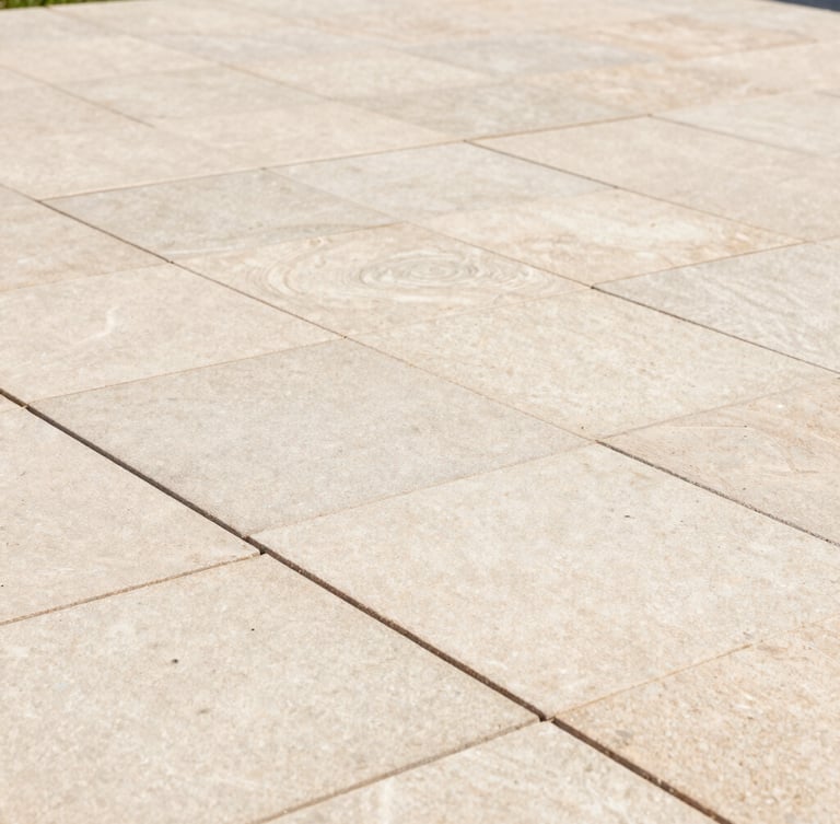 Close-up of a pristine, freshly pointed stone patio with clean joints, sharp focus, warm natural daylight