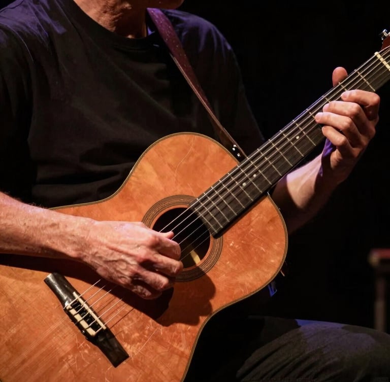Close-up of hands playing a traditional Argentine acoustic guitar under high-contrast warm stage spotlights, rich copper tones and deep shadows, cinematic 35mm photography.