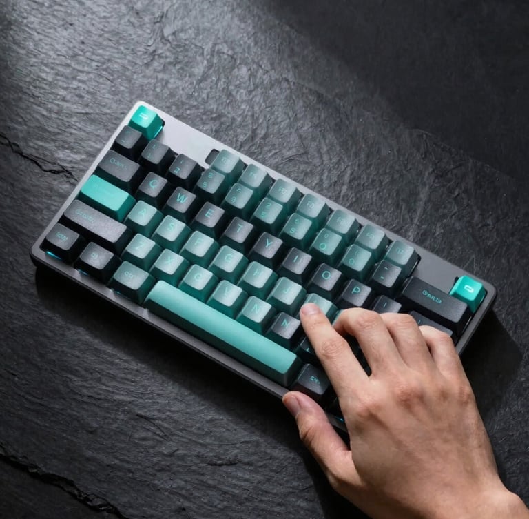 Overhead macro flatlay of a hand interacting with a sleek mechanical keyboard, cool studio lighting, sharp high-contrast shadows, dark slate background, neon teal accents, macro lens