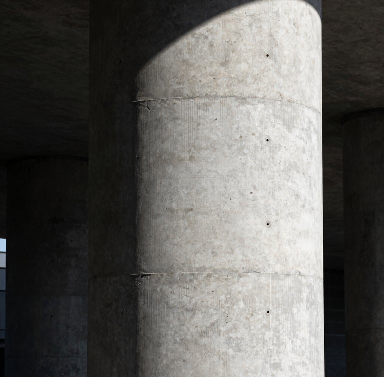 Stark industrial photography, portrait shot of a massive raw concrete pillar under high-contrast direct sunlight, sharp focus, 35mm lens