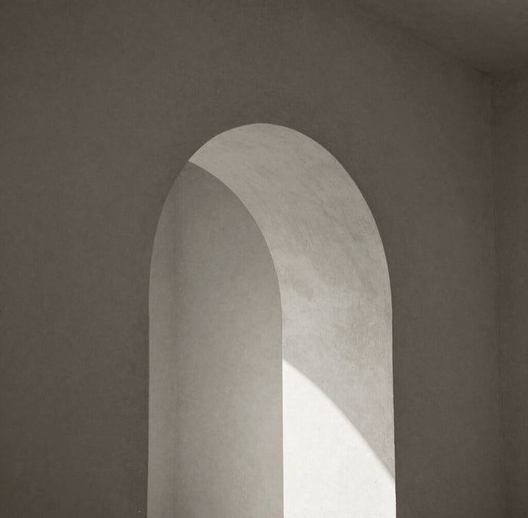 Solitary architectural detail of a concrete archway, abstract soft shadows on a warm plaster wall, minimalist composition, black and white with sepia undertones