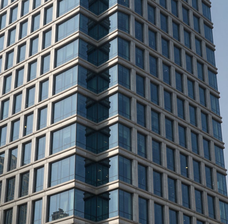 Close-up of structured steel and architectural glass corner of a modern skyscraper in Riyadh under crisp daylight