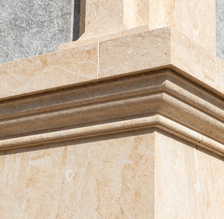 Extreme macro detail of architectural limestone texture, warm cream tones, sharp structural lines, high-performance insulation material visible behind, crisp Mediterranean daylight, 35mm