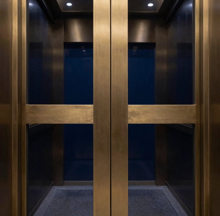 Extreme macro photograph of restored architectural bronze elevator doors, flawless grain, high-contrast dramatic lighting, deep navy reflections, gold metallic sheen, 35mm.