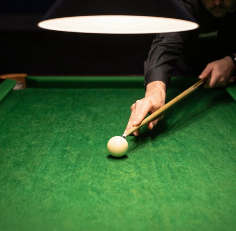 Dramatic close-up of hands tensioning rich green snooker felt over a slate table bed, warm overhead lighting, shallow depth of field, 35mm